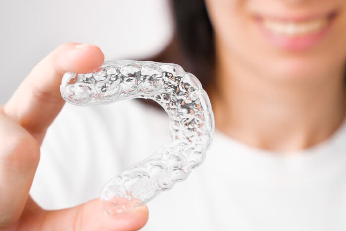 close-up-orthodontic-transparent-aligner-in-womans-2023-11-27-04-51-00-utc
